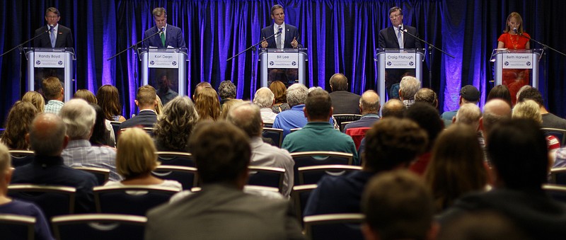 Flanked by fellow gubernatorial candidates Randy Boyd, left, Karl Dean, second from left, Craig Fitzhugh, fourth from left, and Beth Harwell, right, Bill Lee, center, answers a question during a forum hosted by the Chattanooga Times Free Press in the Tennessee Room at the University Center on the campus of the University of Tennessee at Chattanooga on Monday, June 25, 2018 in Chattanooga, Tenn.