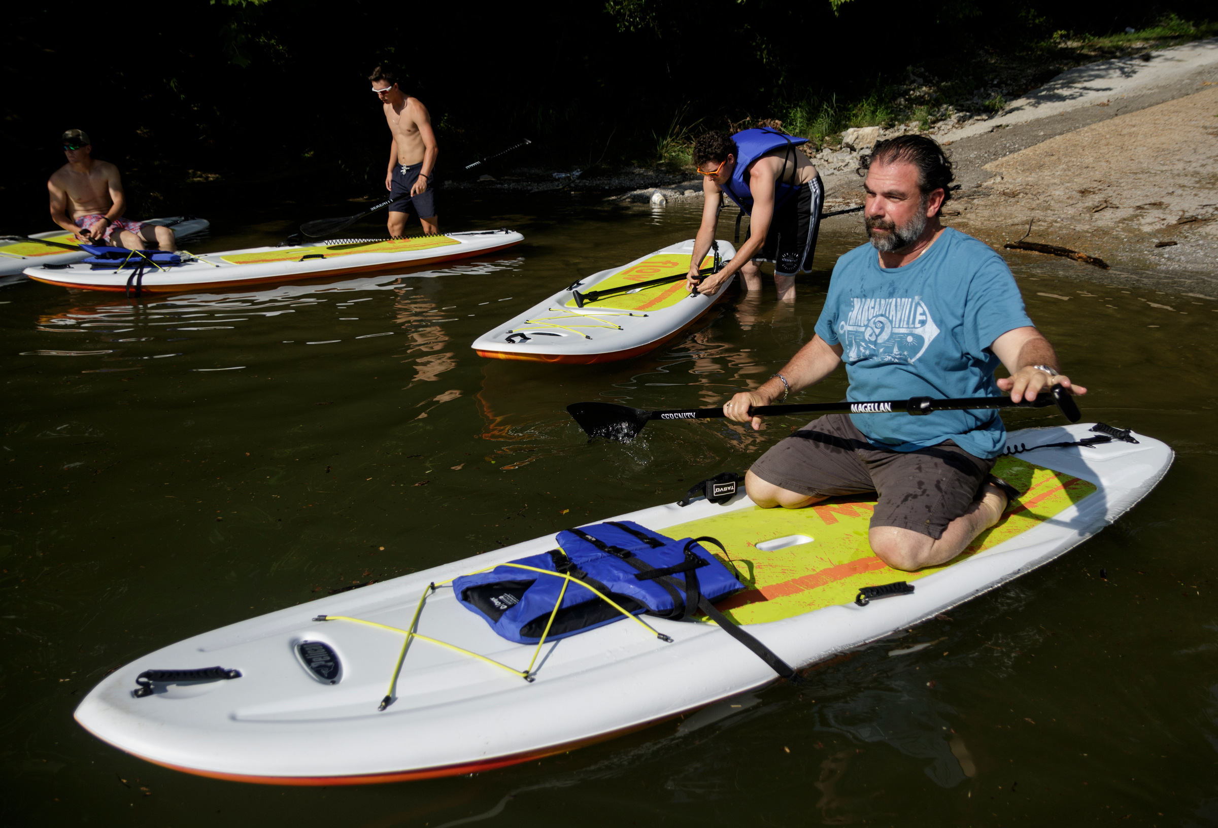 Co-owner Charlie Eich, right, and staff of the River Drifters Bar & Grill take to the Tennessee River nearby for a paddling safety lesson on Wednesday, June 27, 2018, in Chattanooga, Tenn. The new restaurant and paddle rental spot on Suck Creek Road opens July 2.
