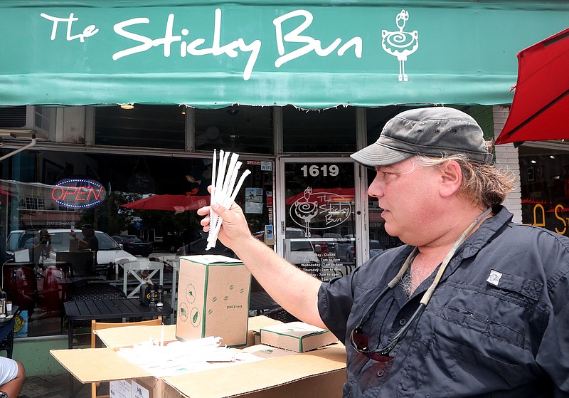 Buddy Sparrow with the Deerfield Beach Island Groups delivers paper strws to the Sticky Bun in Deerfield Beach, Fla. The restaurant never uses plastic straws or polystyrene take-out materials. They are participating in a city-wide "Strawless Summer" effort. (Mike Stocker/Sun Sentinel/TNS)