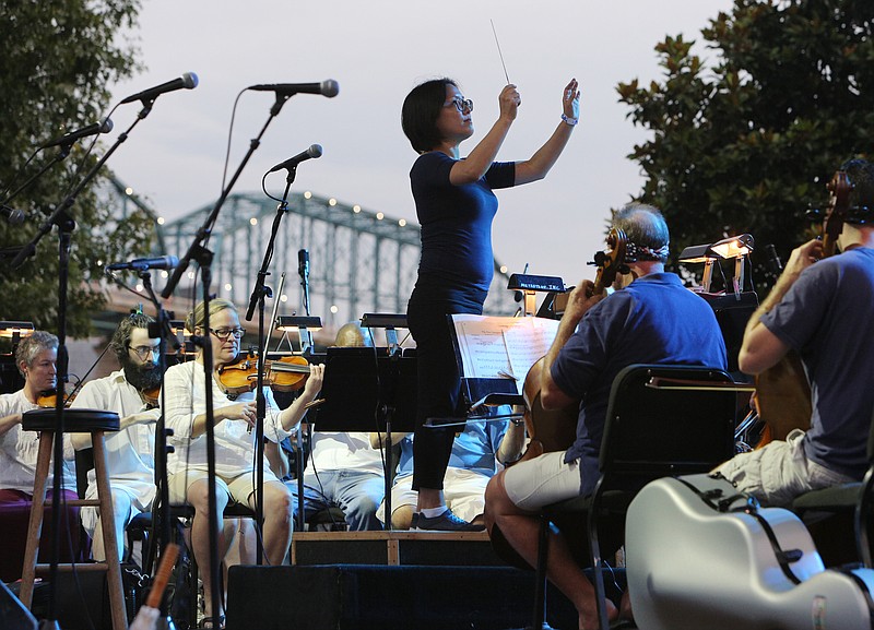 The Chattanooga Symphony and Opera performs a song from "Pirates of the Caribbean" during Pops on the River July 3, 2017, at Coolidge Park in Chattanooga, Tenn. The symphony and opera were joined by guest musicians Fletcher Bright and the Dismembered Tennesseans for some of the selections. 