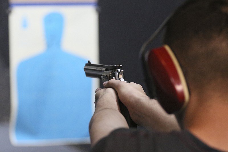 Staff file photo by Dan Henry / The Chattanooga Times Free Press — A shooter takes aim on the gun range at Shooter's Depot in 2017.