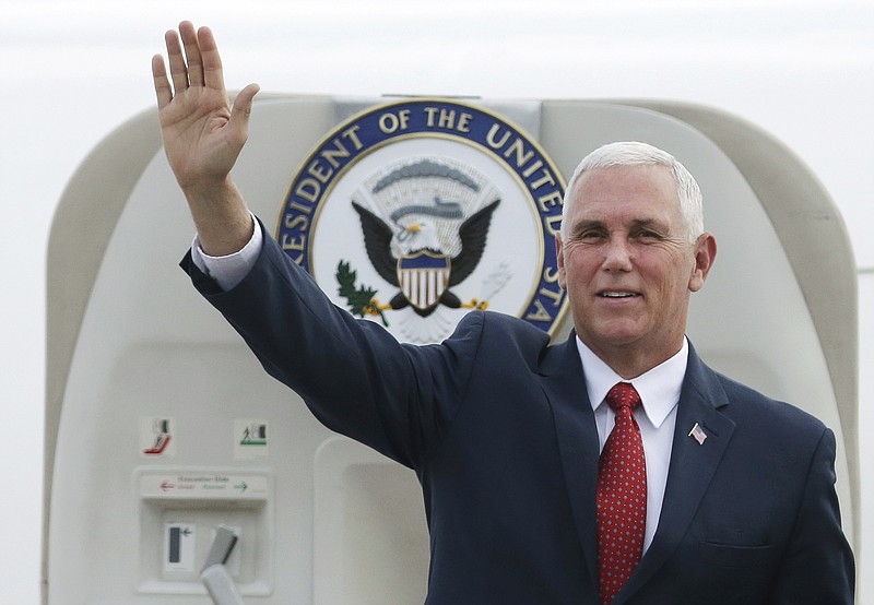 U.S. Vice President Mike Pence waves as he arrives at Brasilia Air Base, in Brasilia, Brazil, Tuesday, June 26, 2018. Pence visits Latin America's largest and most populous nation this week, but the focus of his trip will be the deteriorating humanitarian situation in neighboring Venezuela. (AP Photo/Eraldo Peres)