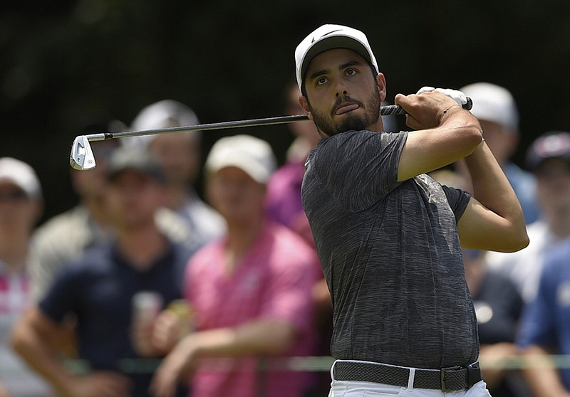 Abraham Ancer watches his tee shot on No. 3 at TPC Potomac at Avenel Farm during the third round of the Quicken Loans National on Saturday in Potomac, Md. Ancer shot an 8-under 62 to share the lead with Francesco Molinari.