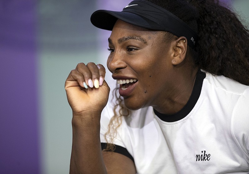 Serena Williams speaks during a news conference Sunday at the All England Club in advance of Wimbledon, which starts today in London. Williams is playing the grass-court major tournament, which she has won seven times, for the first time since becoming a mother last September.