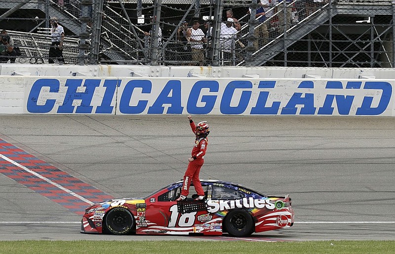 Kyle Busch celebrates after winning Sunday's NASCAR Cup Series race at Chicagoland Speedway in Joliet, Ill. Busch finished ahead of Kyle Larson after an exciting final lap on the 1.5-mile track.