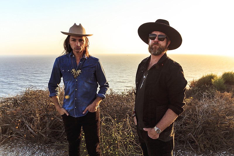 Duane Betts, left, with Devon Allman, whose fathers were Dickey Betts and Gregg Allman, co-founders of the Allman Brothers Band in 1969, are touring together. They will play Songbirds Guitar Museum on Tuesday night.