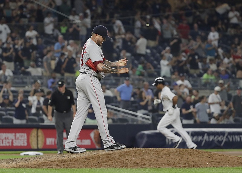 
              Boston Red Sox starting pitcher Hector Velazquez (76) reacts as New York Yankees' Aaron Hicks (31) runs the bases after hitting a home run during the eighth inning of a baseball game Sunday, July 1, 2018, in New York. (AP Photo/Frank Franklin II)
            
