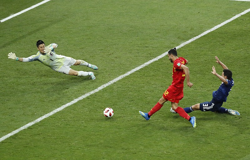 Belgium's Nacer Chadli, center, scores his third side goal during the round of 16 match between Belgium and Japan at the 2018 soccer World Cup in the Rostov Arena, in Rostov-on-Don, Russia, Monday, July 2, 2018. (AP Photo/Hassan Ammar)