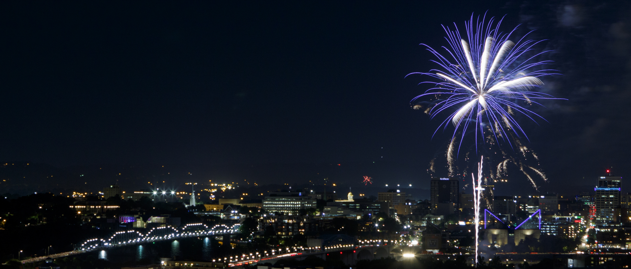 Fireworks from the 2018 Pops on the River Independence Day celebration at Coolidge Park light up the sky over the Tennessee River on Tuesday, July 3, 2018 in Chattanooga, Tenn. The Chattanooga Symphony & Opera played a collection of patriotic music during the free event.