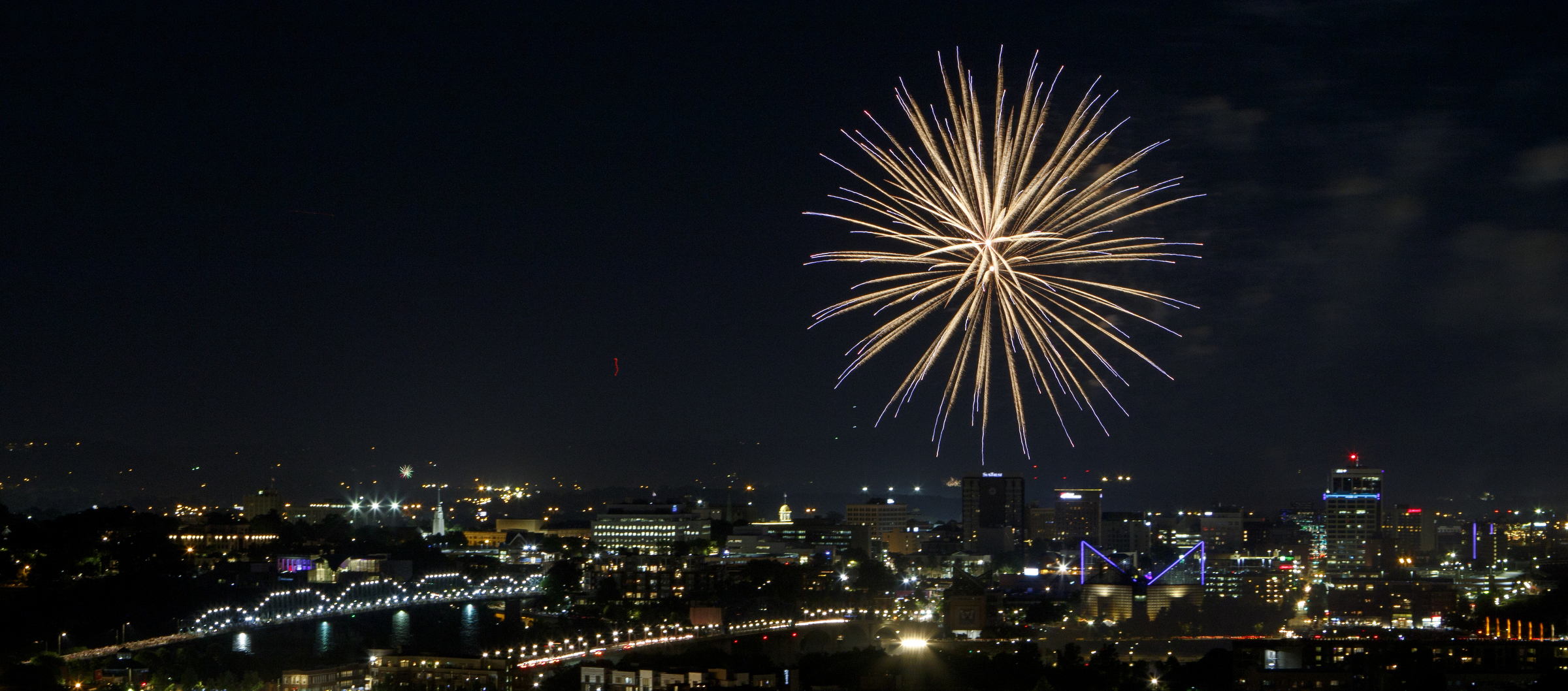 Fireworks from the 2018 Pops on the River Independence Day celebration at Coolidge Park light up the sky over the Tennessee River on Tuesday, July 3, 2018 in Chattanooga, Tenn. The Chattanooga Symphony & Opera played a collection of patriotic music during the free event.
