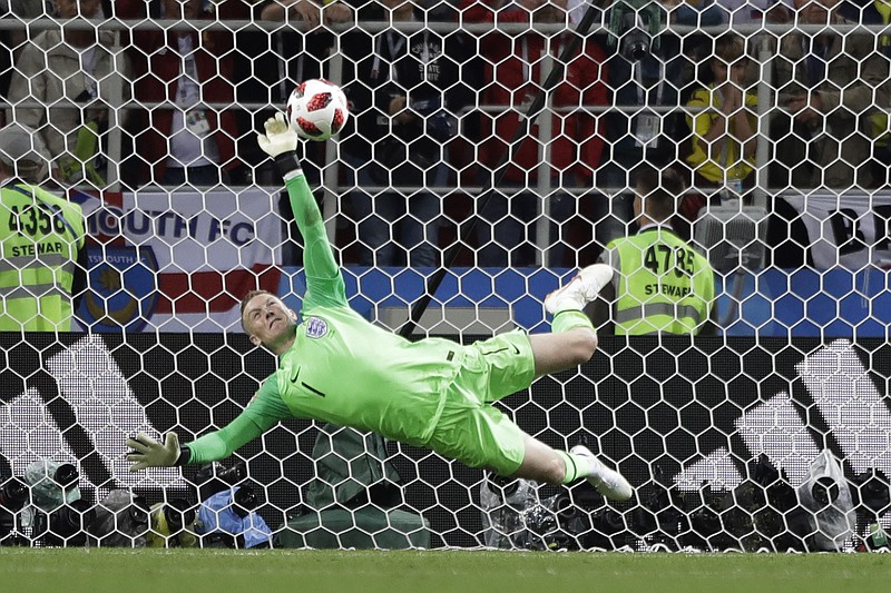 
              England goalkeeper Jordan Pickford saves a penalty during the round of 16 match between Colombia and England at the 2018 soccer World Cup in the Spartak Stadium, in Moscow, Russia, Tuesday, July 3, 2018. (AP Photo/Matthias Schrader)
            