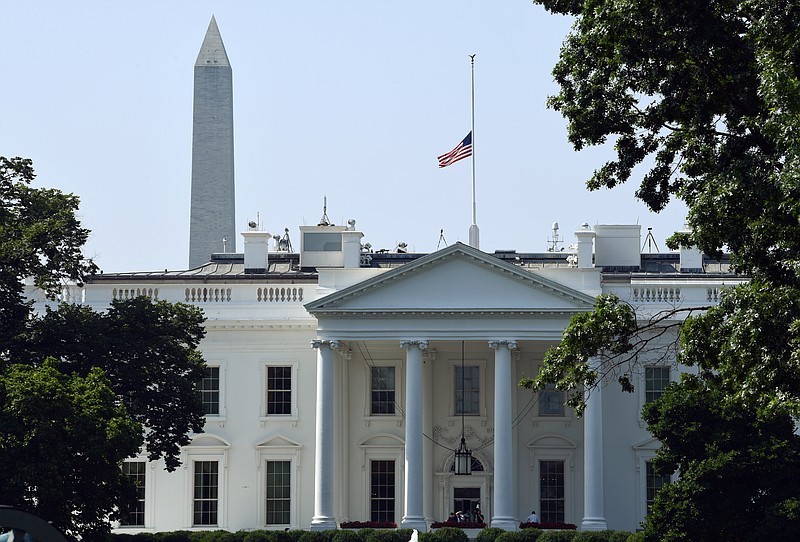 The flag of the United States flies at half-staff over the White House in Washington, Tuesday, July 3, 2018, to honor the five people killed in the Annapolis, Md., shooting at the Capital Gazette newspaper. (AP Photo/Susan Walsh)

