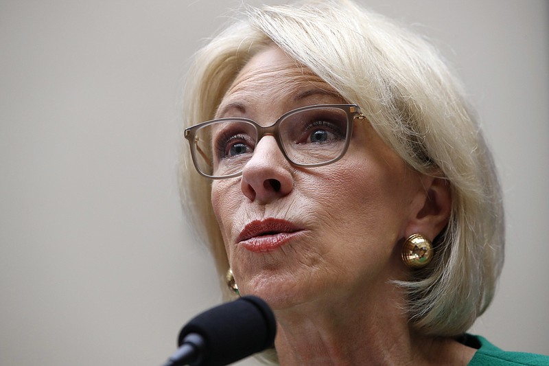 In this May 22, 2018 file photo, Education Secretary Betsy DeVos testifies at a House Committee on Education and the Workforce, n Capitol Hill in Washington. The Trump administration is rescinding Obama-era guidance that encouraged schools to take a person's race into account to encourage diversity in admissions. That's according to an administration official who spoke on condition of anonymity. (AP Photo/Jacquelyn Martin)