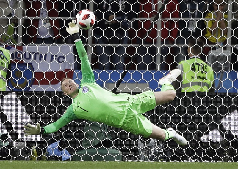 England goalkeeper Jordan Pickford saves a penalty during the round of 16 match between Colombia and England at the 2018 soccer World Cup in the Spartak Stadium, in Moscow, Russia, Tuesday, July 3, 2018. (AP Photo/Matthias Schrader)

