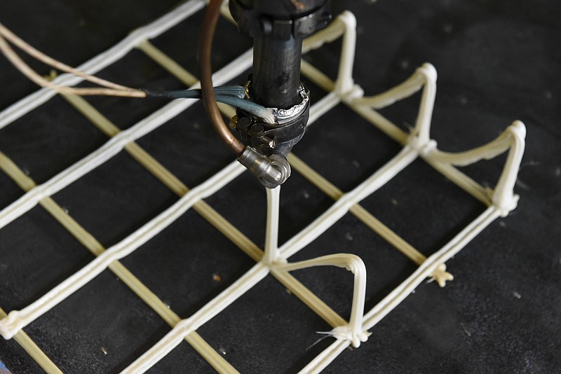 Seen on Wednesday, Nov. 4, 2015, at the Business Development Center in Chattanooga, Tenn., this 3D printer designed and built by Branch Technology builds a grid structure. Unlike 3D printers that work in layers, this printer combines industrial robotics and 3D printing to make structural components used in high-end architecture. 