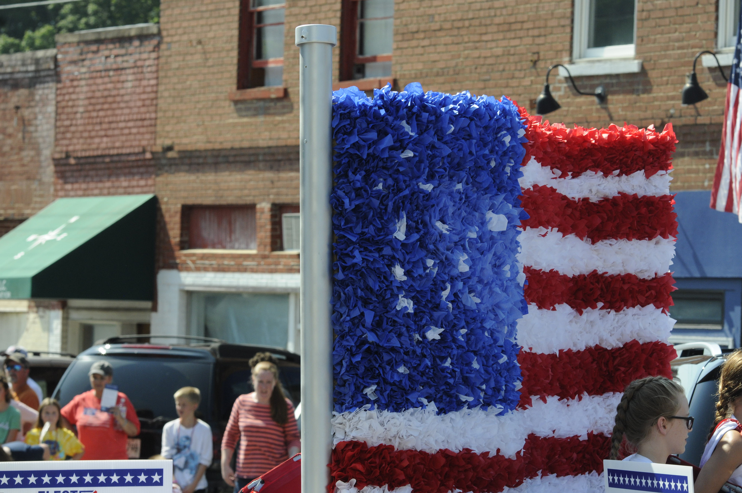 Bright patriotic colors highlight the annual Fourth of July parade with an abundance of election campaign candidates aboard in downtown Dunlap.