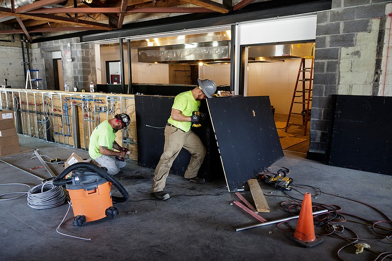 Construction progresses on a new restaurant called State of Confusion being built on the former site of Estate of Confusion on Main Street on Friday, June 29, 2018, in Chattanooga, Tenn. 