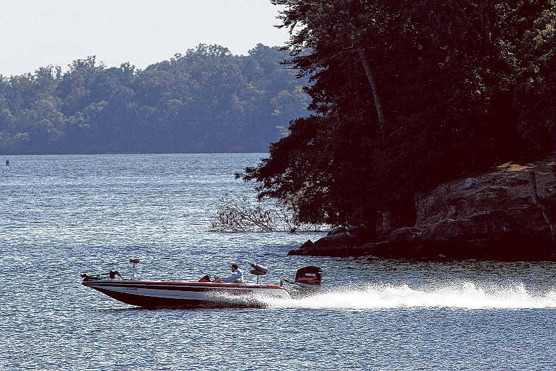 A fisherman motors through Chickamauga Lake in Lakesite, Tenn., in 2015.