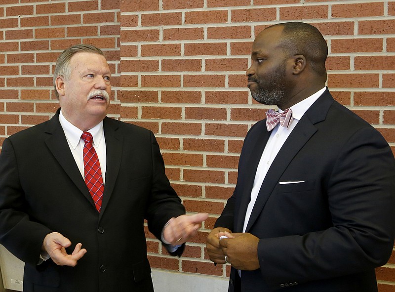 Hamilton County Mayor Jim Coppinger, left, and Superintendent Bryan Johnson mingle after a news conference announcing the launch of the Future Ready Institutes at Howard School on Thursday, March 15, 2018, in Chattanooga, Tenn.