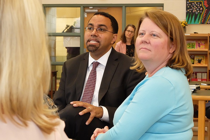 Former U.S. Secretary of Education John King, left, talks to first-year principals in the library at Battle Academy in this 2017 file photograph. Jill Levine, right, now is the chief of the Hamilton County Schools' Opportunity Zone.