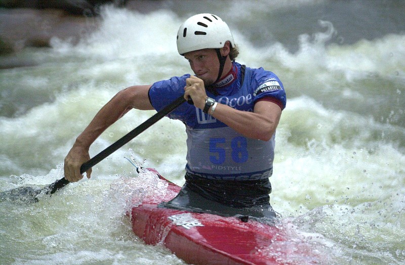 Adam Boyd paddles his canoe through the churning waters of the Ocoee River Sunday afternoon as he competes for the USA in the finals of the 2000 Ocoee World cup. The World Cup competition is a series of 6 events, the first of which was held in Australia, and the final four will be held in Europe.