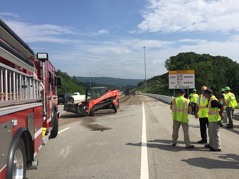 Crews work to clean up a spill from trucks carrying biosolids on Highway 27 north at Dayton Boulevard. (Photo: Bruce Garner/Chattanooga Fire Department)