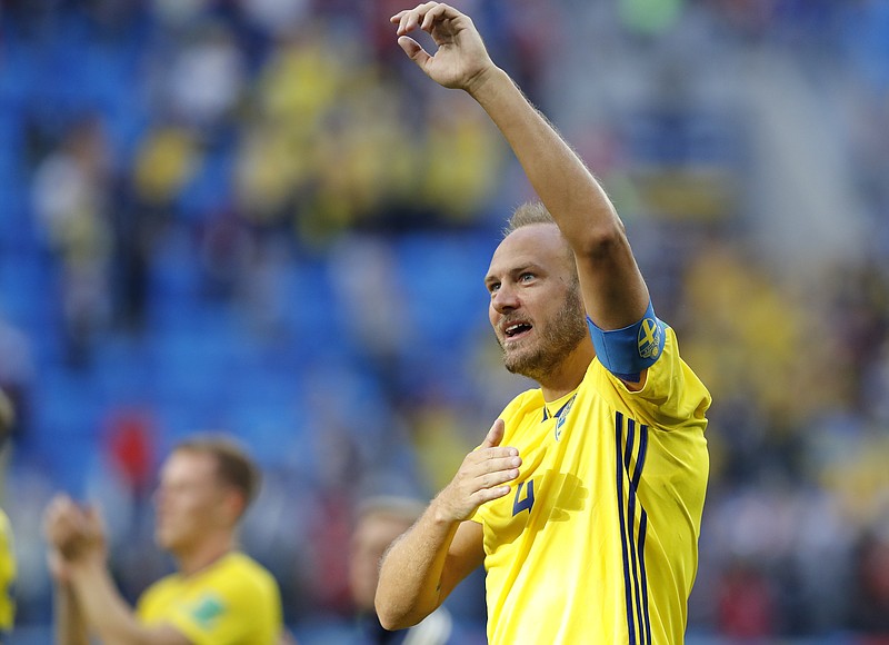 
              Sweden's Andreas Granqvist celebrates his team victory over Switzerland at the end of the match during the round of 16 match between Switzerland and Sweden at the 2018 soccer World Cup in the St. Petersburg Stadium, in St. Petersburg, Russia, Tuesday, July 3, 2018. (AP Photo/Efrem Lukatsky)
            