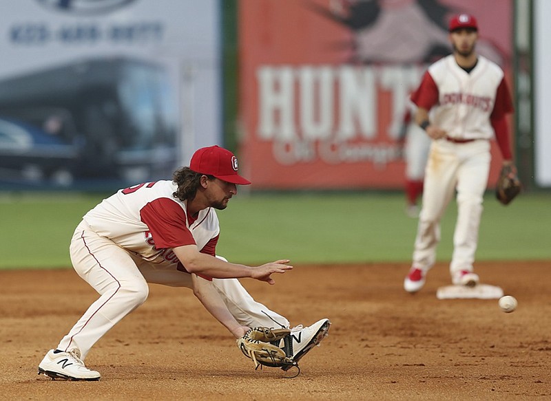 The Chattanooga Lookouts' Sean Miller fields a ground ball during a game against the Mobile Baybears last month at AT&T Field. Miller has been suspended for 50 games after a second positive test under minor league baseball's drug program.