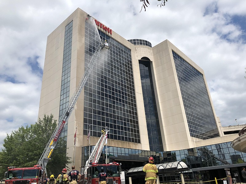 Chattanooga Fire Department crews responded to the Marriott Chattanooga Downtown hotel Sunday afternoon where the "M" in the hotel's sign on the Carter Street side caught fire.