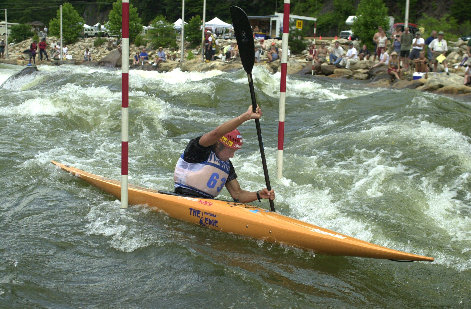 Margaret Langford of Canada paddles upstream as she negotiates a slalom gate during the finals of the 2000 Ocoee World Cup event Sunday afternoon. Langford was among the leaders in the Women's 1-Person Kayak event, one of four events that had their finals Sunday. The event drew competitors from around the world.