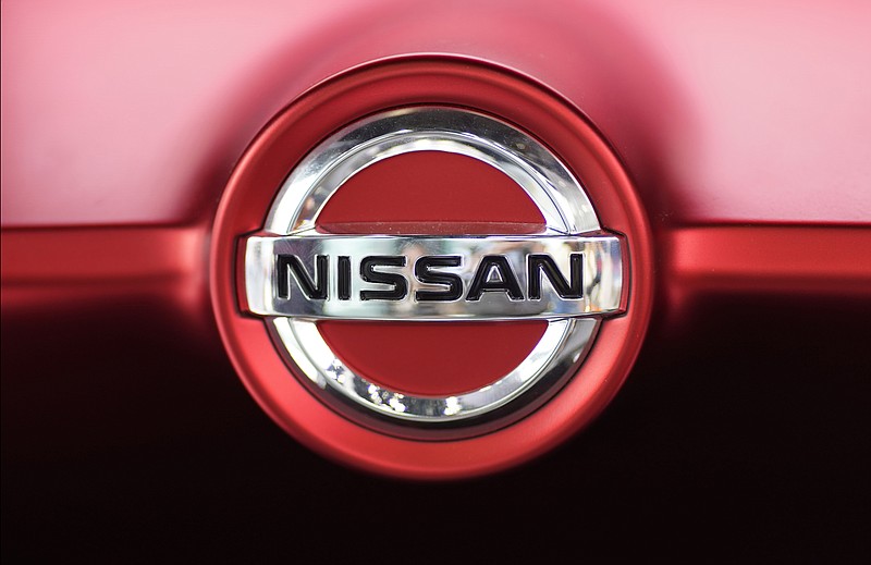 FILE - This June 14, 2018, file photo, shows a Nissan logo on a Nissan Concept 2020 Vision Gran Truismo on display at the automaker's showroom in Tokyo. Nissan Motor Co. says it has altered results of exhaust emissions and fuel economy tests of its new vehicles sold in Japan, in the latest misconduct to surface at the Japanese automaker. (AP Photo/Shuji Kajiyama, File)