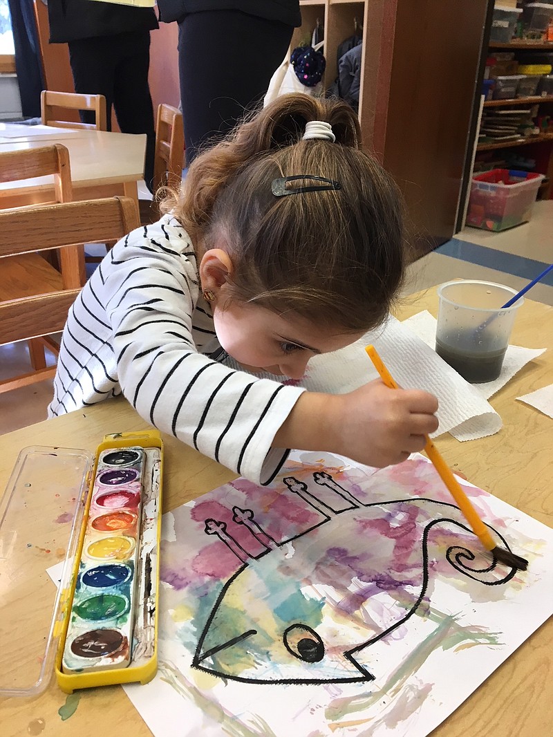 Talia, a student at St. Augustine Learning Center, experiments with watercolor. St. Augustine is holding its first summer camp, Camp Create, July 16-20.