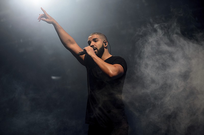 
              FILE - In this June 27, 2015 file photo, Canadian singer Drake performs on the main stage at Wireless festival in Finsbury Park, London. All 25 tracks from Drake’s ultra-popular “Scorpion” album, released on June 29, are on the Billboard Hot 100 chart. (Photo by Jonathan Short/Invision/AP, File)
            