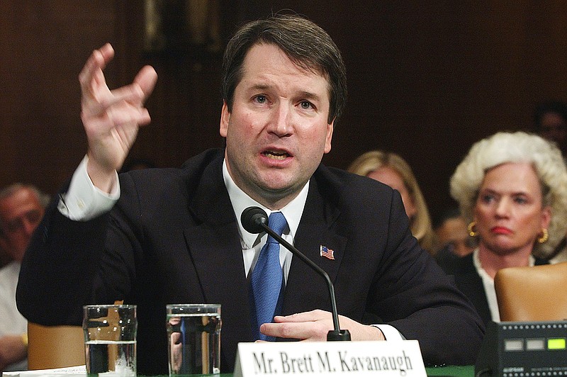 FILE -In this April 26, 2004, file photo, Brett Kavanaugh appears before the Senate Judiciary Committee on Capitol Hill in Washington.