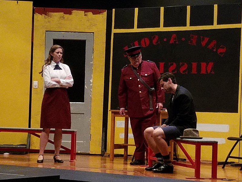 Rehearsing a scene in "Guys & Dolls" are, from left, Rebecca Ford as Sarah Brown, Rodney Strong as a Save-a-Soul Mission worker and Alex Ford as Sky Masterson. (Photo: East Brainerd Community Theater)