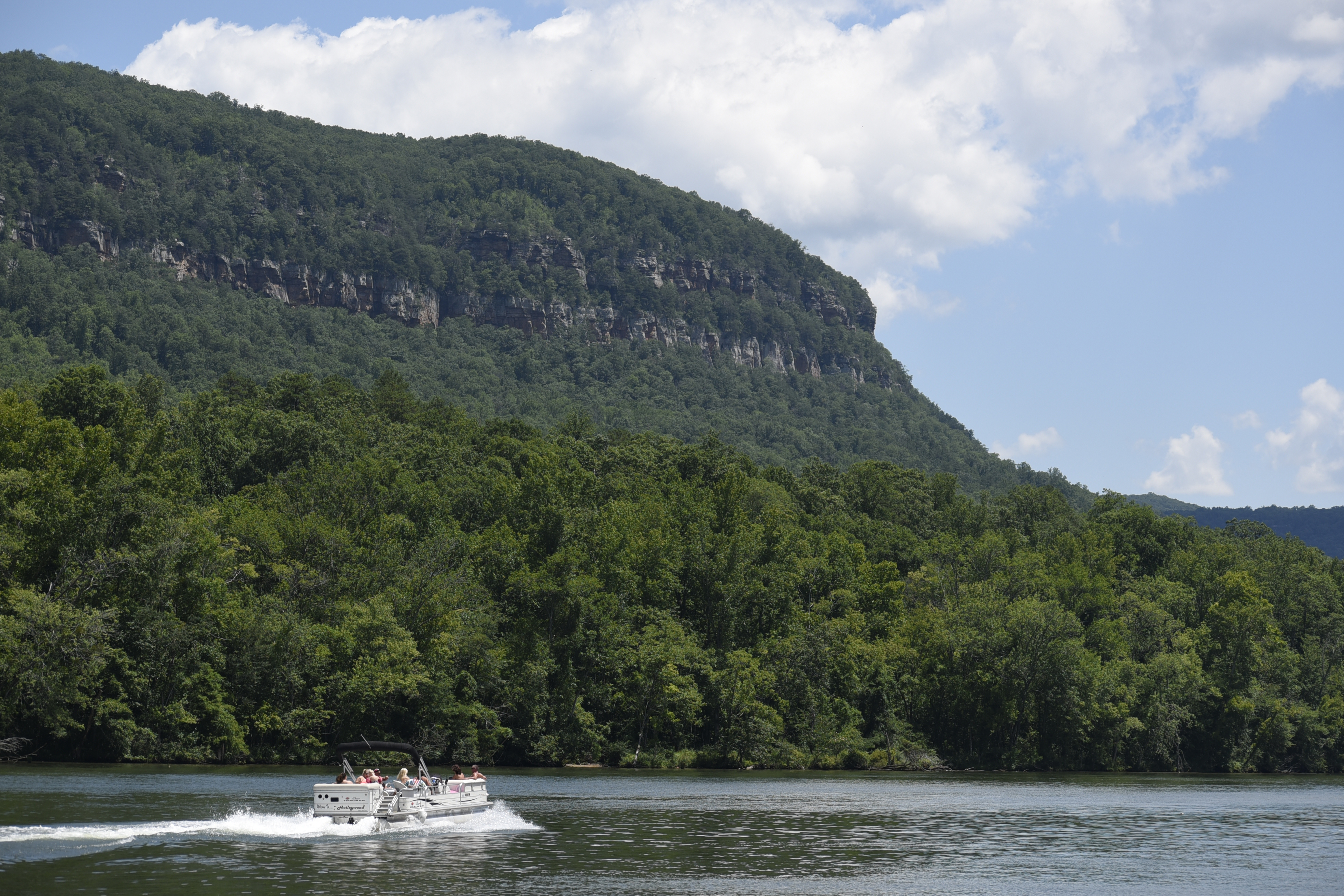 A pontoon boat makes its way upstream on the Tennessee River past Prentice Cooper State Forest on the north bank and TVA's Raccoon Mountain Pump Storage intakes on a beautiful day recently. The Tennessee River Gorge is 26 miles long making it the fourth largest canyon in the United States. According to WRCB weather today will see a high of 89 with little chance of rain.