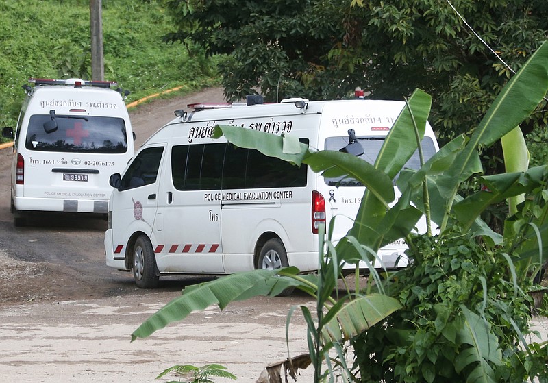 Two ambulances arrive near the cave to wait for more evacuations of the boys and their soccer coach who have been trapped since June 23, in Mae Sai, Chiang Rai province, northern Thailand Monday, July 9, 2018.