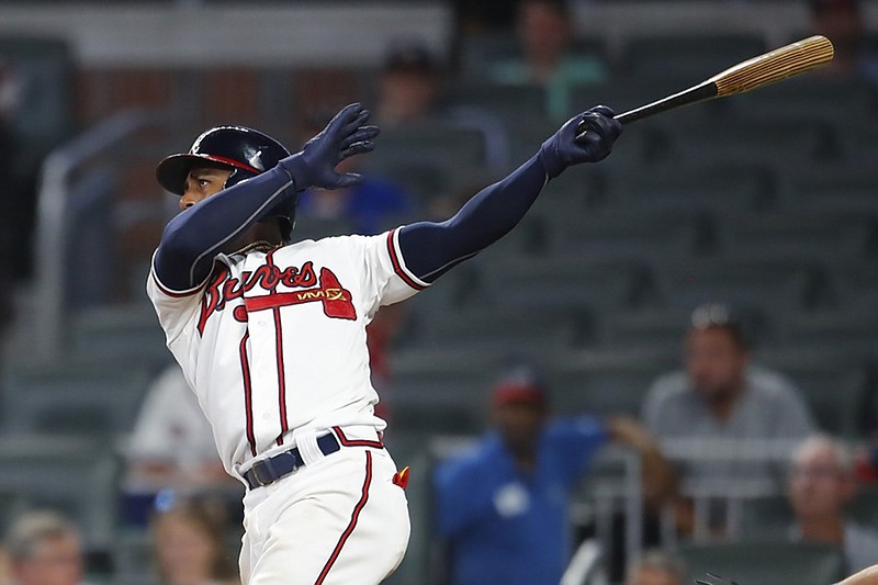 The Atlanta Braves' Ozzie Albies watches his two-run home run in the eighth inning of Wednesday night's 9-5 home win against the Toronto Blue Jays. Albies homered twice and drove in four runs.