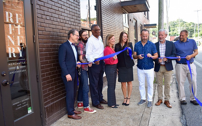 The ribbon cutting for the new Refinery store at 3800 St. Elmo Ave. on Wednesday morning. From left to right: Sen. Bo Watson; Plus Coffee Owner Matthew Park; City councilmember Erskine Oglesby Jr.; Juli-Ann Morgan from SouthEast Bank; Robin Parker from SouthEast Bank; Keith Wooten, Refinery owner; Carl Greene, Refinery owner; and Brian Davis, lead pastor at St. Mark's United Methodist Church in the North Shore.
