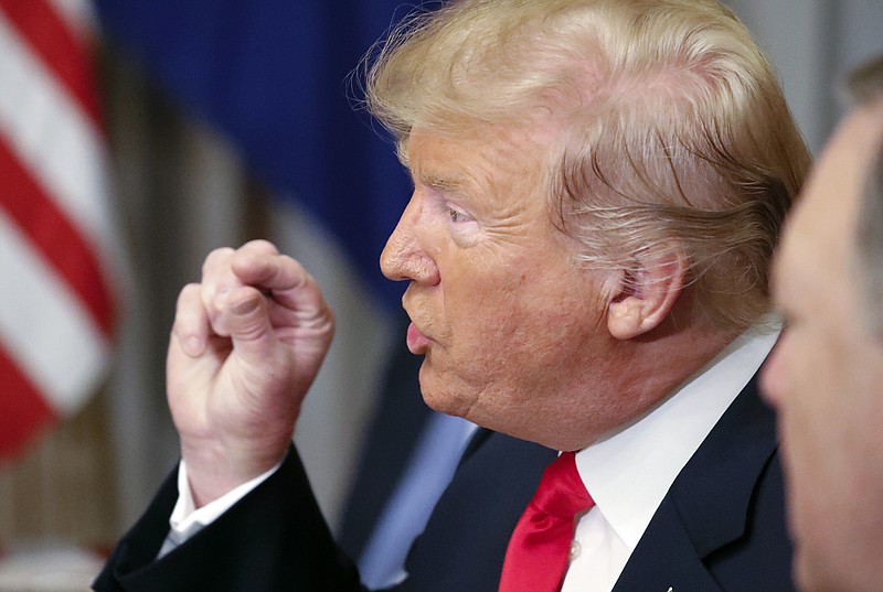 U.S. President Donald Trump gestures while speaking to NATO Secretary General Jens Stoltenberg during their bilateral breakfast, Wednesday, July 11, 2018 in Brussels, Belgium. (AP Photo/Pablo Martinez Monsivais)