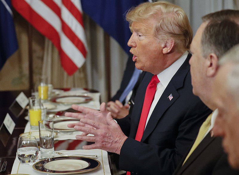 U.S. President Donald Trump gestures while speaking to NATO Secretary General Jens Stoltenberg during their bilateral breakfast, Wednesday, July 11, 2018 in Brussels, Belgium. (AP Photo/Pablo Martinez Monsivais)

