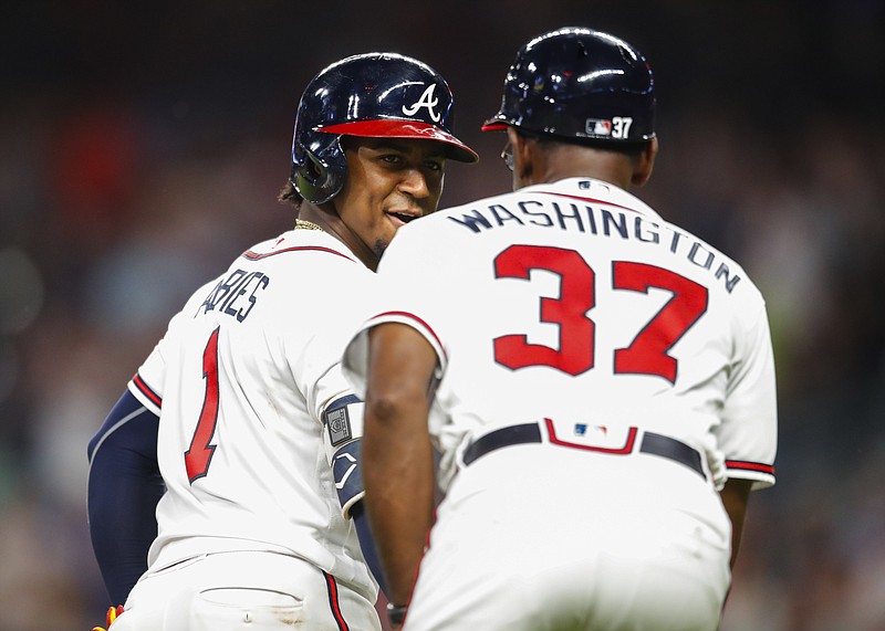 Atlanta Braves second baseman Ozzie Albies shakes hands with third base coach Ron Washington after hitting his first of two home runs in Wednesday night's home win against Toronto. Albies has been a bright spot lately, but the Braves have lost six of their past eight games.