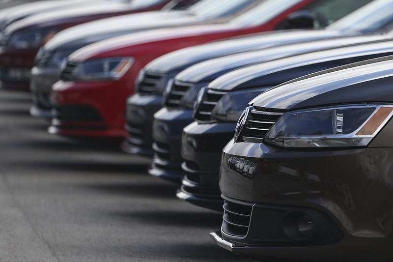 New cars are lined up at Village Volkswagen's car lot on Monday, Feb. 2, 2015.