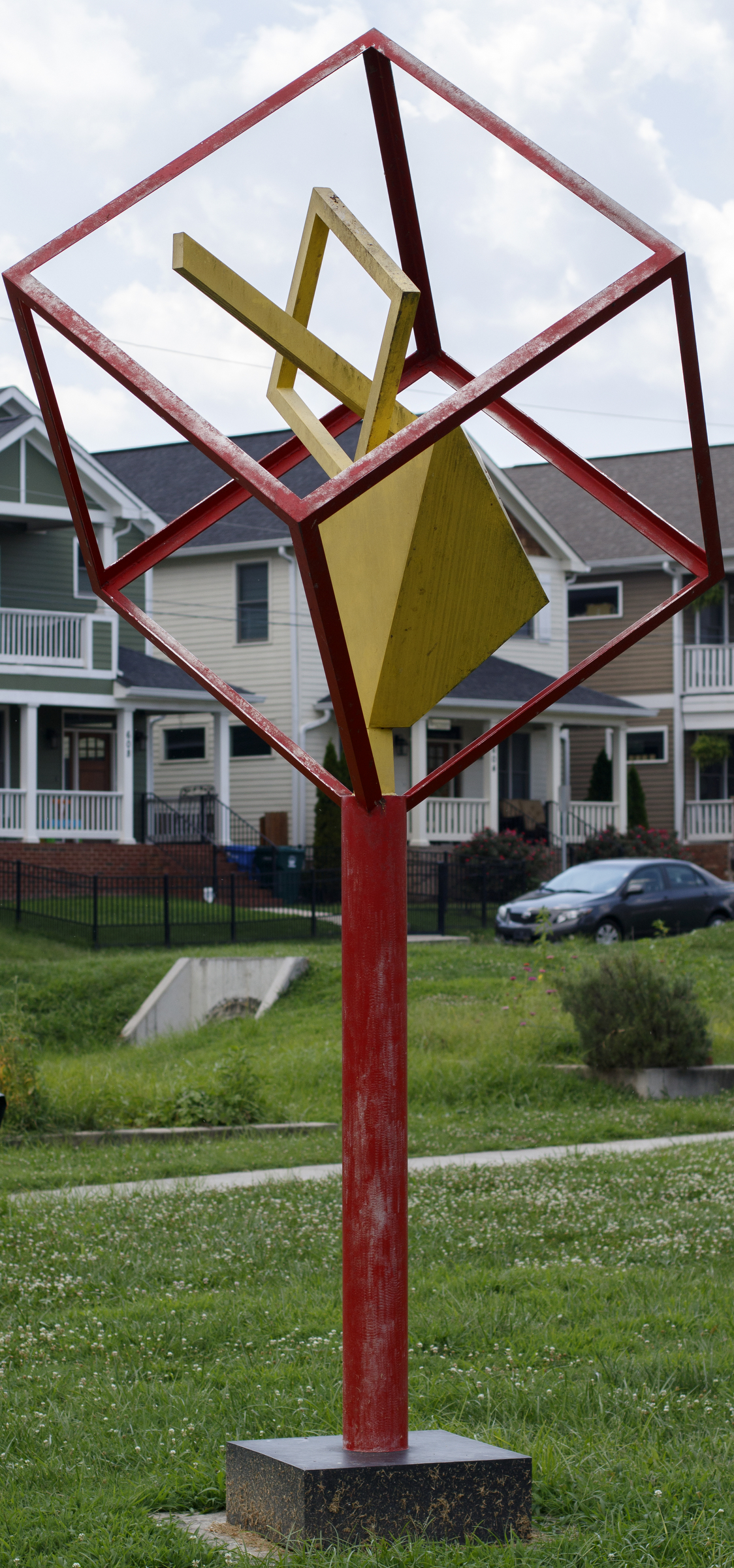 "Geometry in a Box" by Samuel Burns stands in the Jefferson Heights Park on Wednesday, July 11, 2018 in Chattanooga, Tenn.