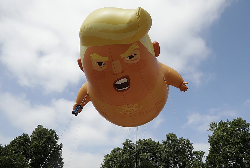 A six-meter high cartoon baby blimp of U.S. President Donald Trump is flown as a protest in Parliament Square in London last week as a protest to his visit to Britain. (AP Photo/Matt Dunham)