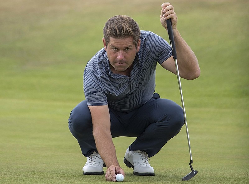 Robert Rock waits to putt on the 17th hole at Gullane Golf Club during Friday's second round of the Scottish Open. Rock shot a 7-under 63 and led after setting the tournament's 36-hole record at 13-under 127.
