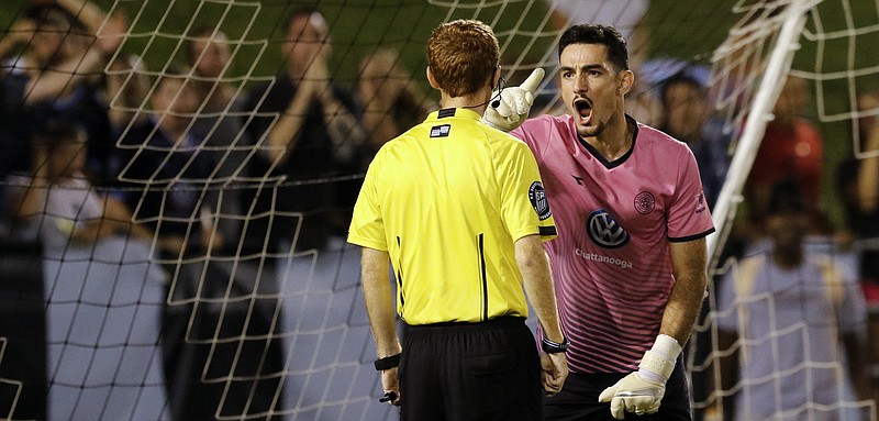 Chattanooga FC keeper Philip D'Amico gets in the face of the referee after having a penalty-kick save called back because he moved early during the shootout against the Atlanta Silverbacks on Saturday night at Finley Stadium.