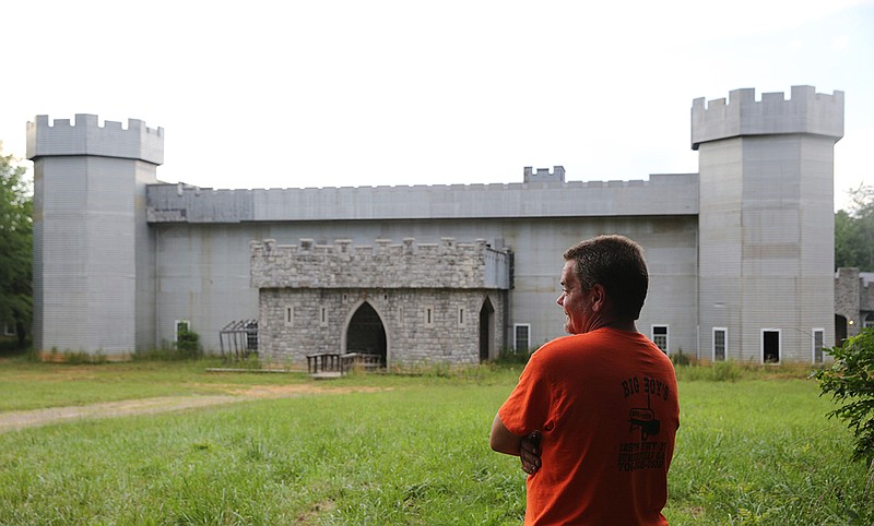 Staff photo by Erin O. Smith / 
Steve Werner looks out over a piece of property that now belongs to him as well as his siblings Wednesday, June 27, 2018 in Cloudland, Georgia. The partially completed castle was created by Werner and his parents after his mom dreamed up the idea.