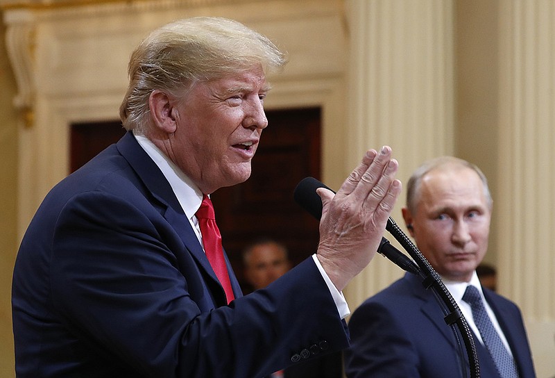 U.S. President Donald Trump, left, speaks alongside Russian President Vladimir Putin during a news conference after their meeting at the Presidential Palace in Helsinki, Finland, Monday. (AP Photo/Pablo Martinez Monsivais)