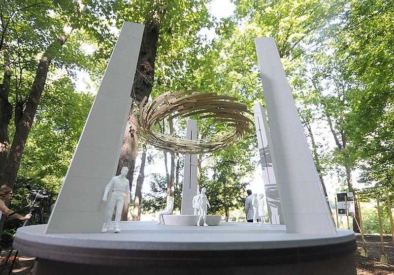 A model of the "Wreath of Honor," the art monument by Norman Lee chosen for the Fallen Five Memorial, is on display at Thursday's groundbreaking event at the Tennessee Riverpark off Amnicola Highway in Chattanooga.